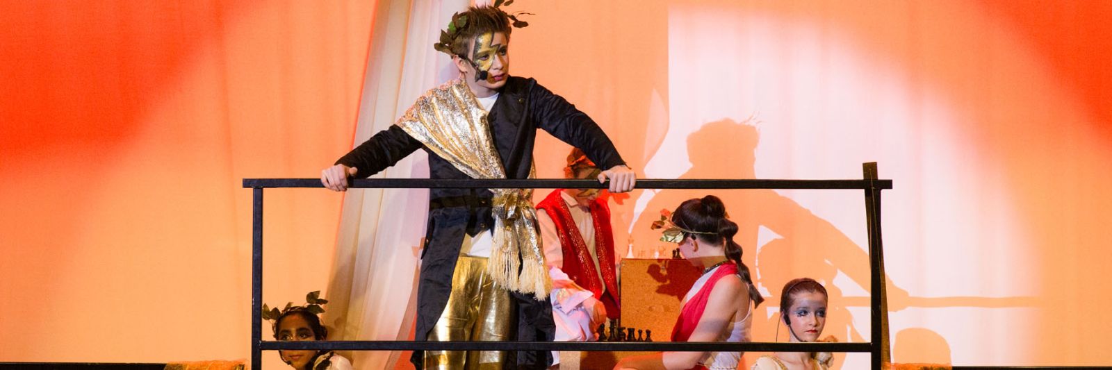 Photo of senior pupils on the stage in the school play