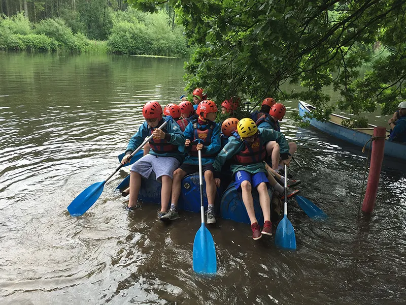 a group of students rowing